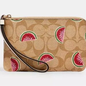 Coach corner zip wristlet in signature canvas